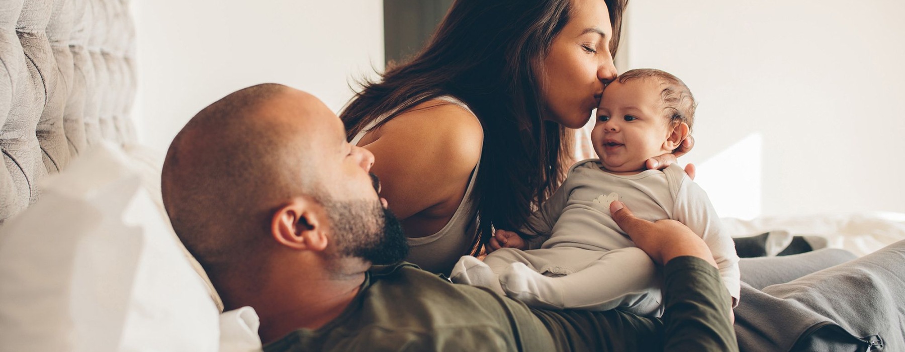 a family holding a baby